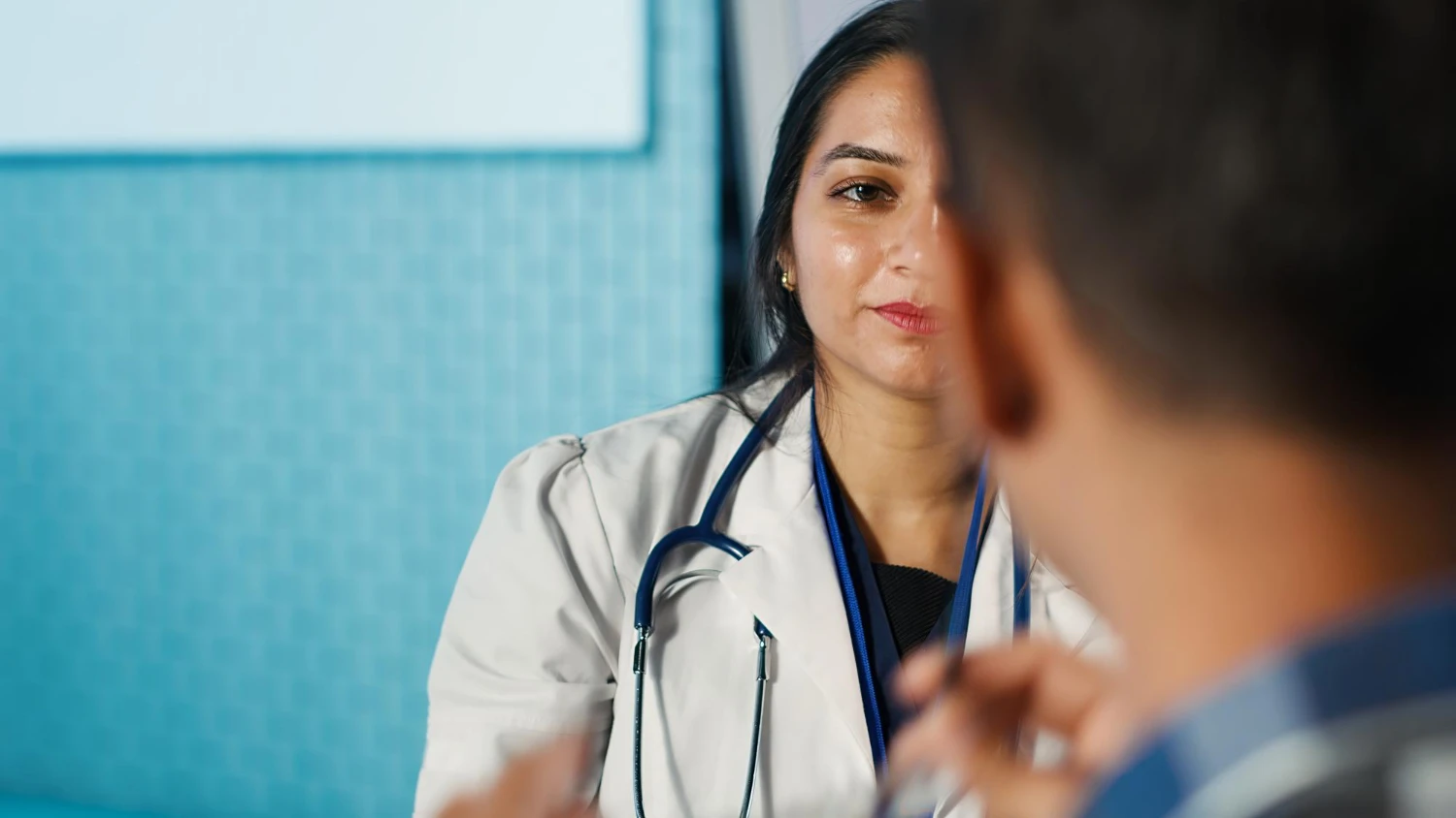 Doctor providing consultation at home